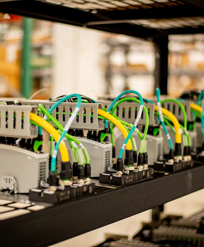 A close view of neatly routed wires and electrical terminal components in an assembly.